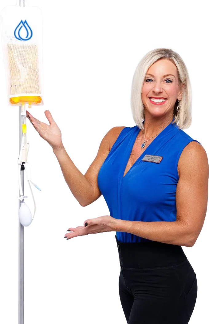 IV Wellness™ nurse holding a vitamin infusion bag during a mobile IV therapy visit.